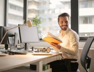 Man smiling in office